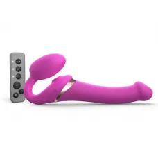 Ярко-розовый безремневой страпон Multi Orgasm Size M с клиторальной стимуляцией ярко-розовый 